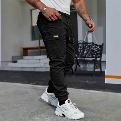 👖50 % Rabatt🏃 Sweathosen im Workwear-Stil | Kordelzug in der Taille · Strapazierfähiges Polyester · Konisch zulaufende Hosenbeine · Mehrere Taschen